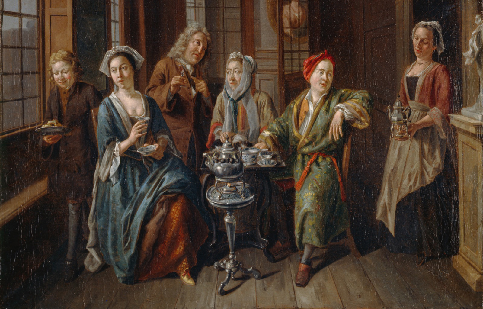 Josef Van Aken, A Tea Party - This is an early example of an English 'Conversation Piece', or informal group portrait, a genre whose evolution was largely informed by Van Aken's knowledge of Dutch and Flemish interior subjects. The figures are dressed in fashionable indoor clothes, the man in an informal gown with a loose cap, instead of a wig. There's a tea set in the middles and the subjects are all leaning in as if in mid conversation.