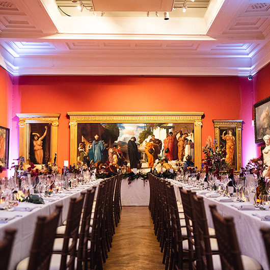 Wedding dinner set up with long tables in Victorian Galleries