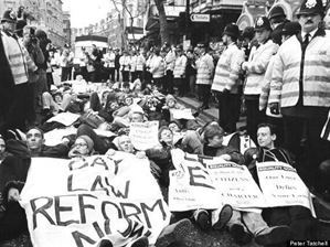 Derek Jarman (front, left) awaiting arrest after police blocked the OutRage! March on Parliament for the repeal of anti-gay laws (February 1992)