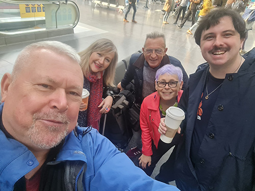 Members of Pocket Park group as they board the train in Piccadilly station