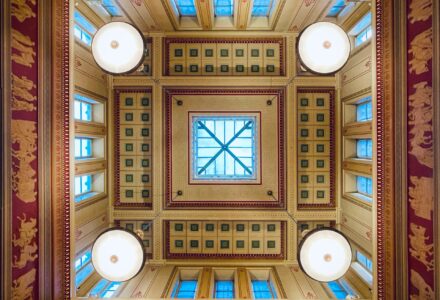 View of the Victorian Ceiling of the Gallery from below. Geometrical square with a central lantern and 4 circular lamps. All around rectangular window and a series of high relief.
